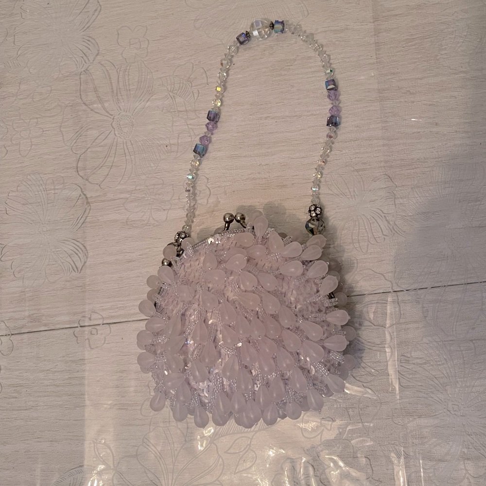 La Ragale purple beaded clutch